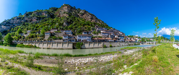 A panorama view across the River Osum towards the Old Quarter in Berat, Albania in summertime