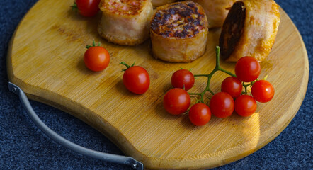 Roulette on the board with wheat and tomatoes