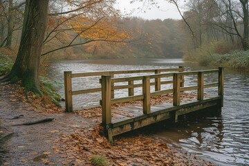 A tranquil riverbank scene with a quaint wooden footbridge, connecting two picturesque shores