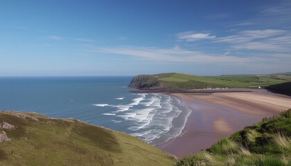 summer sky warm day in rhossili beach south wales view over the ocean