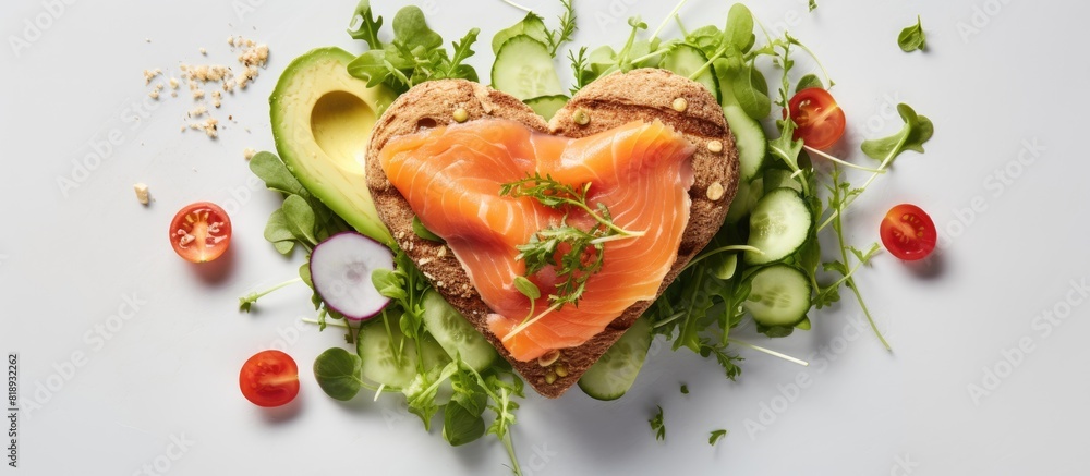 Poster a heart shaped sandwich with avocado paste and salmon is displayed on a white background creating a 