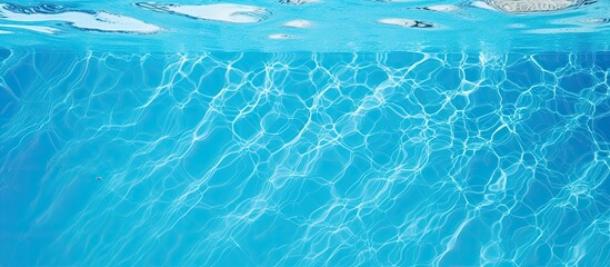 A clear blue swimming pool s close up with copy space image - Powered by Adobe