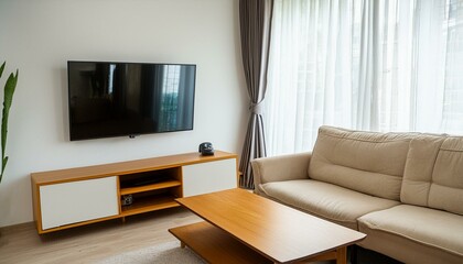 Natural Wood Coffee Table in a Minimalist Living Room: Beige Sofa and TV Unit Against a Window"