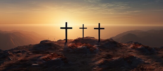 At sunrise there is a copy space image of three crosses being crucified on a hill - Powered by Adobe