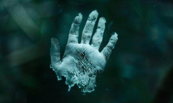 Human handprint as identification, symbolization of difference, exceptionality and gender, dark background.