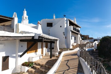 typical whitewashed buildings in the picturesque village of Binibeca Vell on Menorca