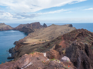Obraz premium Cape Ponta de Sao Lourenco, Canical, East coast of Madeira Island, Portugal. Scenic volcanic landscape of Atlantic Ocean, rocks and cllifs and cloudy sunrise sky. Views from popular hiking trail PR8