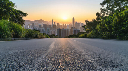 Obraz premium An empty paved summer road to the metropolis, stretching into the distance with clear skies above and the city skyline visible on the horizon.