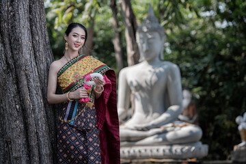 women in traditional clothing on Buddhist on background. Portrait women in traditional clothing , Thai traditional in Ayutthaya, Thailand.