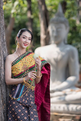 women in traditional clothing on Buddhist on background. Portrait women in traditional clothing ,...