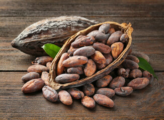 cocoa beans on a brown wooden table
