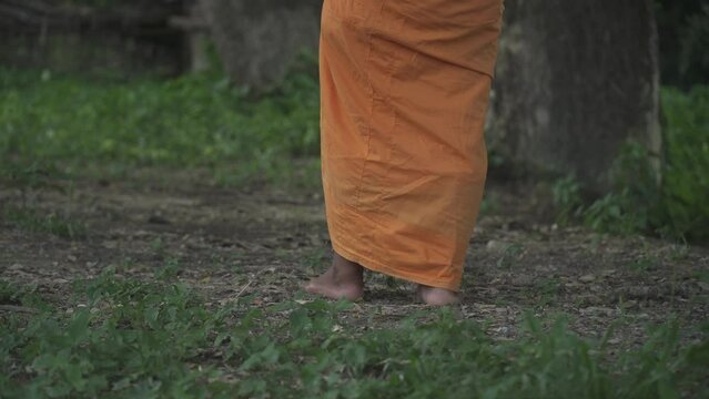 The monk walked slowly and mindfully.