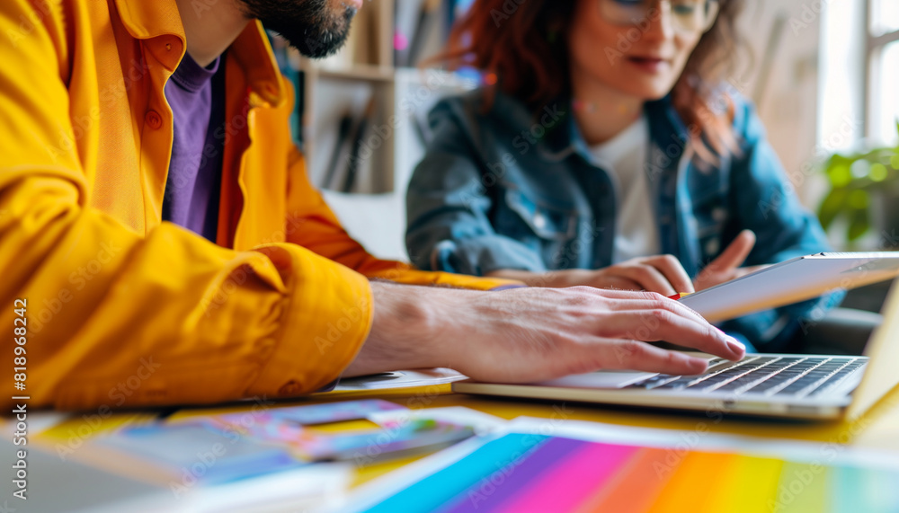 Poster a close-up image of an lgbtq+ professional explaining a project to a client using a laptop, with bot