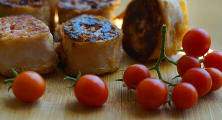 Roulette on the board with wheat and tomatoes