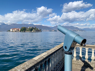 A telescope to view the island of the Orta San Giulio at the lake of Orta