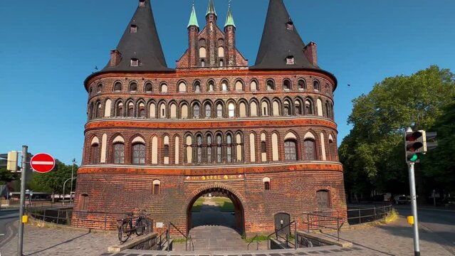 Holstein Gate or Holstentor Gate in historical center ancient city of Lubeck, Germany August 12, 2023. High quality 4k footage