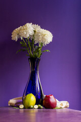 still life with flowers and apples