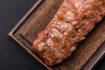 Raw pork ribs marinated with salt, spices and herbs