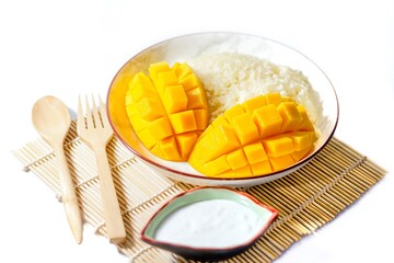 Sweet and delicious with Mango sticky rice on bamboo mat with white background on isolated concept.