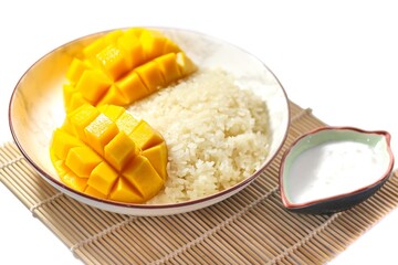 Mango sticky rice put on white background with isolated and top view concept.