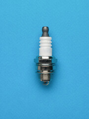 Close-Up of Industrial Spark Plug on Blue Background - Automotive Engine Component Design for Print, Card, Poster