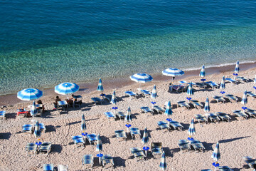 Sunbeds with umbrellas on the beach for publication, design, poster, calendar, post, screensaver,...