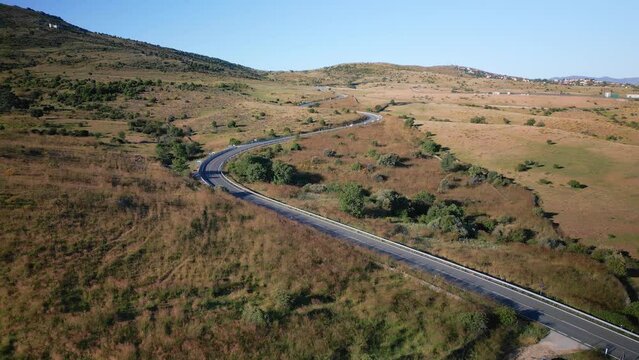 Mountain road where vehicles circulate next to the great mountain of Madrid, Spain.