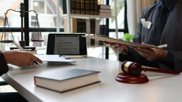 Legal advisor lawyer is signing contract document and handshake. Signing of a legal cooperation agreement. MOU signing