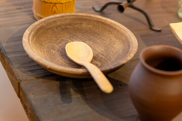 rustic wooden cutlery with plates in a restaurant
