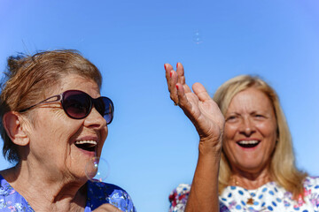 women family spending time together in summer. Leisure for elderly