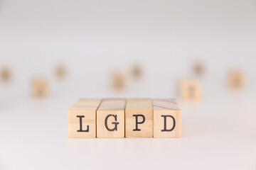 LGPD letter. Concept of brazilian data protection law written on wooden cubes isolated on white background.