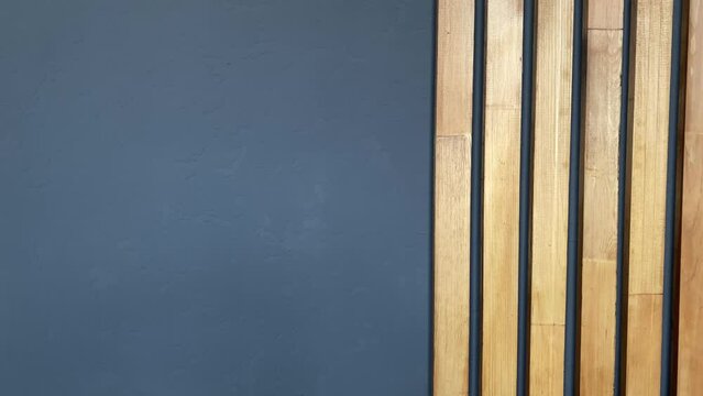gray wall and decor.walls and wooden boards. wooden decor close-up. slow motion video. High-quality shooting in 4K format.