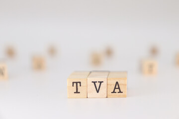 TVA acronym. Concept of Value Added Tax written on wooden cubes isolated on white background.