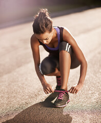 Woman, road and shoelaces on shoe for run and fitness, training and marathon for workout. Sports,...