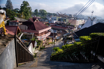 Naklejka premium One of the famous stairways in Bukit Tinggi is called Janjang 40. It consists of 40 steps and was built by the Dutch in 1908 to connect Pasar Atas and Pasar Bawah 