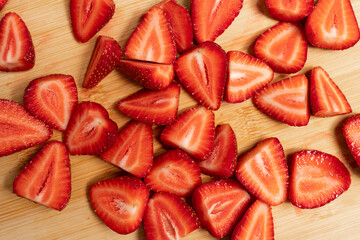Delicious fresh strawberries on a wooden table. Food background.