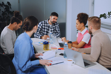 Diverse Team Brainstorming in Modern Office