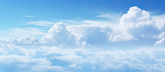 The blue sky is adorned with white veil clouds providing a beautiful and serene copy space image