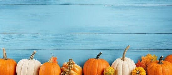 Thanksgiving day Flat lay composition with pumpkins on light blue wooden table space for text. copy space available - Powered by Adobe