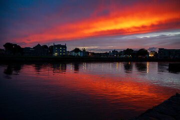 Fototapeta premium Red and Blue Sky Reflecting in Water