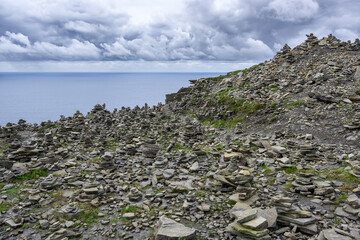 Rocky Hill Overlooking Body of Water