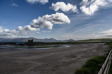 Wooden Fence on Beach With Mountains
