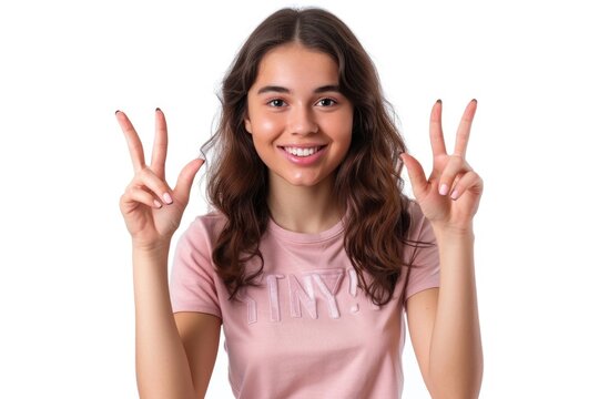 Woman posing with peace sign gesture, suitable for lifestyle or diversity concepts