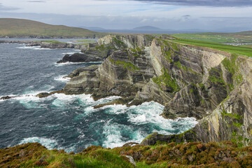 Rocky Cliff Overlooking Nearby Body of Water