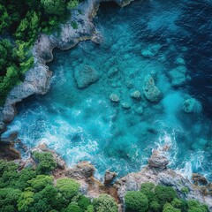 Fototapeta premium Aerial drone top view of ocean's beautiful waves crashing on the rocky island coast Please provide high-resolution