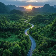 Aerial view of countryside road passing through the green forrest and mountain Please provide high-resolution