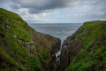 Fototapeta premium A View of a Body of Water From a Cliff
