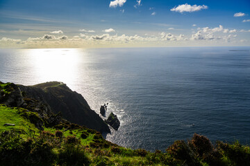 Large Body of Water on Lush Green Hillside