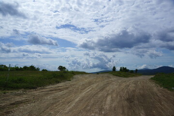landscape with a field and clouds