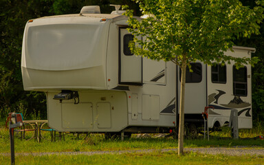Rv fifth wheel camper parked at campsite